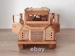Special handmade wooden Land Rover Defender 110. Off-road diacast model car